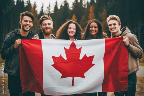 Obraz na płótnie Smiling friends with the Canadian flag, embodying the spirit of patriotism and educational opportunities. w salonie