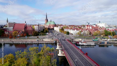 Szczecin from a bird's eye view on a sunny day. View of the city from the Oder River. City buildings, the seaport in Szczecin and its most characteristic places.