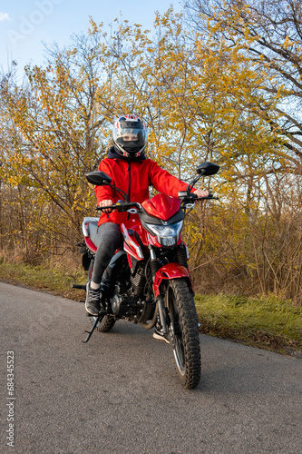 biker girl in red. red motorcycle.