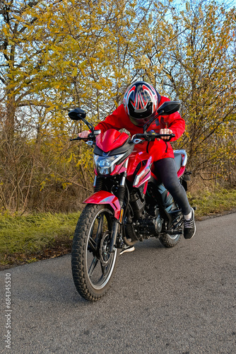 biker girl in red. red motorcycle.