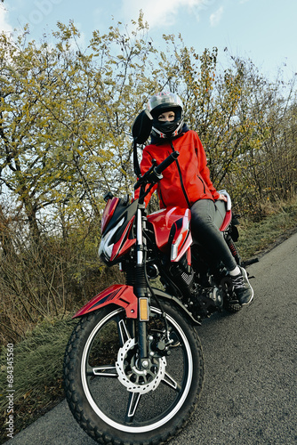 biker girl in red. red motorcycle.