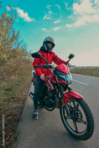 biker girl in red. red motorcycle.