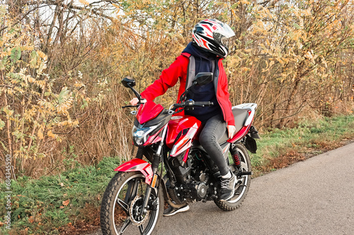 biker girl in red. red motorcycle.