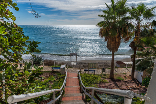 Stairs going down to Carabeo beach in the municipality of Nerja, Malaga. photo