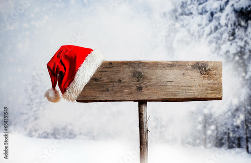christmas hat on empty wooden board