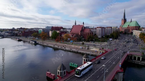 Szczecin from a bird's eye view on a sunny day. View of the city from the Oder River. City buildings, the seaport in Szczecin and its most characteristic places.