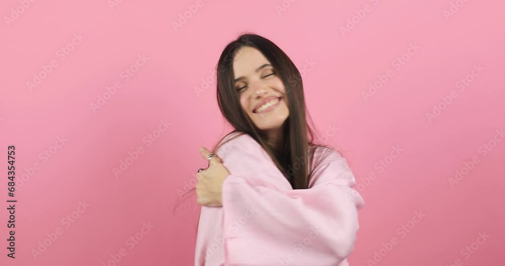 Come into my arms. Adorable happy girl with brown hair in pink dress gesturing come here for free hugs and smiling sincerely with welcoming expression isolated on pink background. Come to me, hug self Come into my arms. Adorable happy girl with brown hair in pink dress gesturing come here for free hugs and smiling sincerely with welcoming expression isolated on pink background. Come to me, hug self