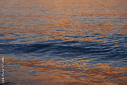 Magical color of the sea waves at sunset © Yurgentum