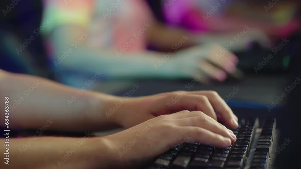 E-Sports Gamer Pressing Buttons On Keyboard To Write Messages To Team In Chat. Gamer Playing Video Games On Mechanical Keyboard. Controlling Computer Game Action With Professional E-Sport Keyboard E-Sports Gamer Pressing Buttons On Keyboard To Write Messages To Team In Chat. Gamer Playing Video Games On Mechanical Keyboard. Controlling Computer Game Action With Professional E-Sport Keyboard