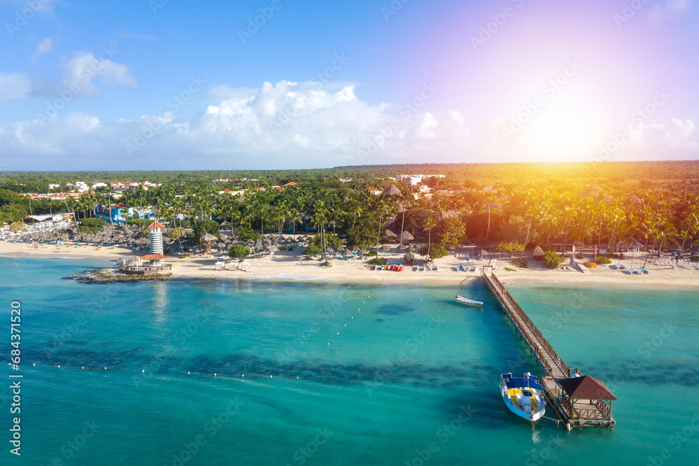 Dominicus beach at Bayahibe with Caribbean sea sandy seashore, lighthouse and pier. Aerial view - obrazy, fototapety, plakaty 