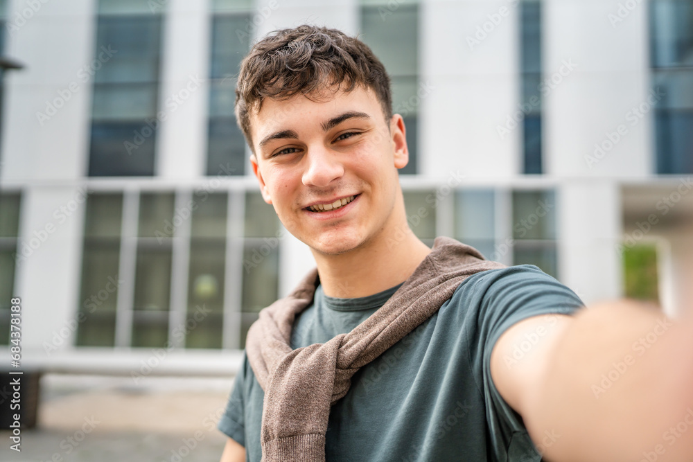 Fototapeta premium portrait of young Caucasian man teenager 18 or 19 years old outdoor
