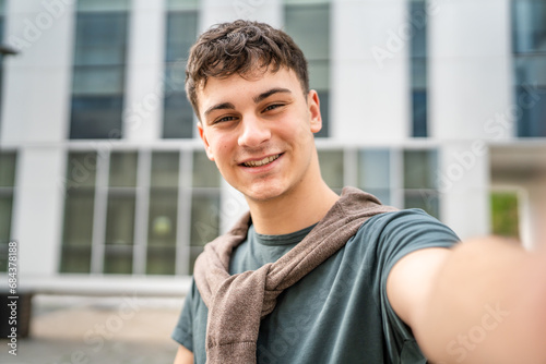 portrait of young Caucasian man teenager 18 or 19 years old outdoor photo