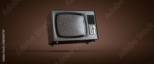 Obraz na płótnie téléviseur vintage acier et métal en lévitation sur un fond orange, bruit dans l