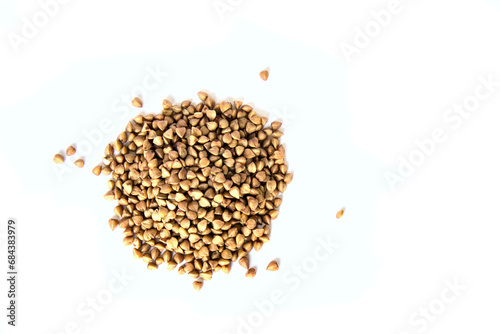 buckwheat in a pile (isolated on white background) cut out close up (kasha, healthy grain, seed, food)
