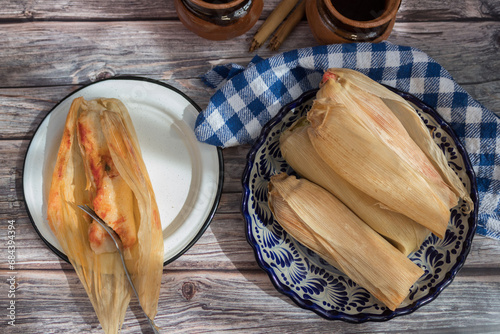 Vista superior de mesa srvida con tamalesComida típica mexicana. Día de la Candelaria photo