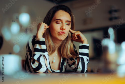Cuadro en lienzo Stressed Woman Covering Her Ears in a Noisy Place