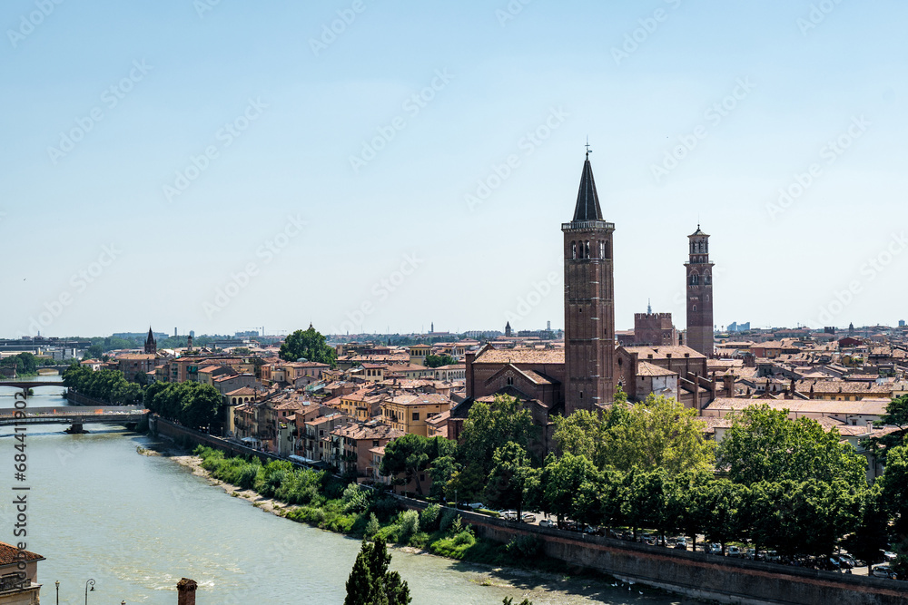 View of Verona city. Colorful residential buildings over Adige river in Verona, Italy