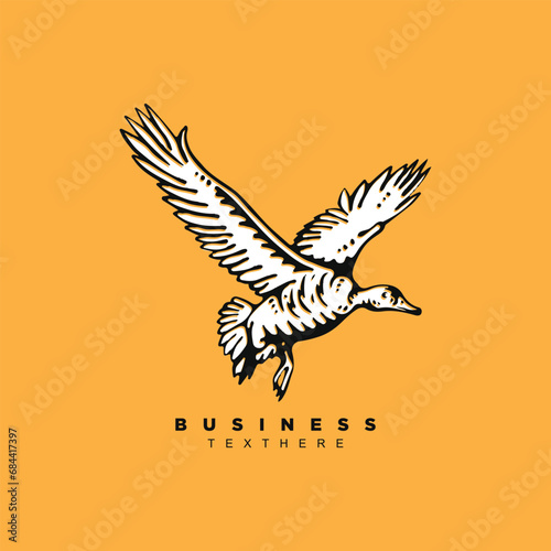 Vintage hand drawn flying wild duck isolated on yellow background