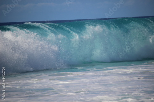 aquamarine waves crashing on the shoreline