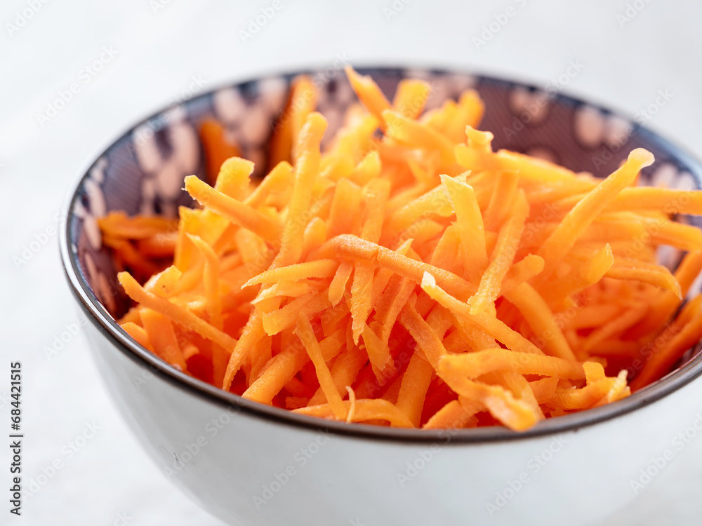 shredded carrots in a bowl shredded carrots in a bowl