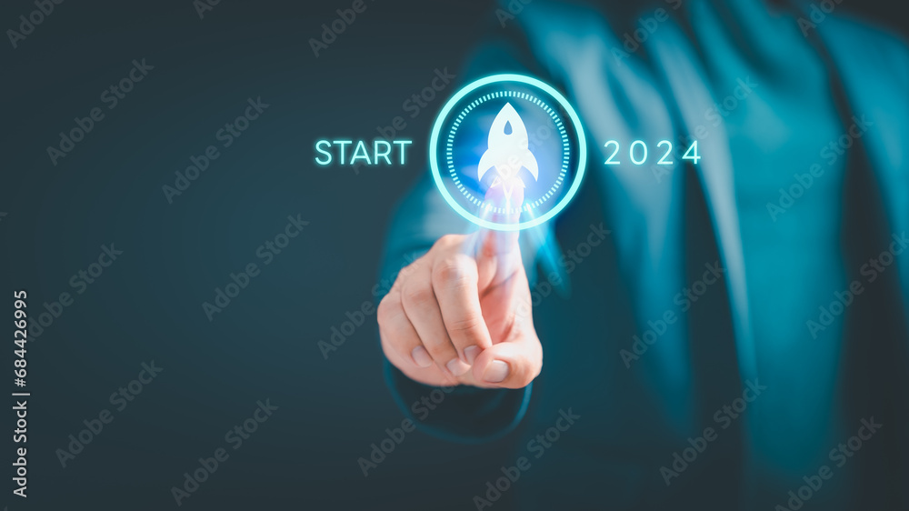 Businessman touching space rocket icon for start in 2024, Corporate Ambitions, Achieving Success through Innovation, plan and vision, progress and success, business challenge technology concept. Businessman touching space rocket icon for start in 2024, Corporate Ambitions, Achieving Success through Innovation, plan and vision, progress and success, business challenge technology concept.