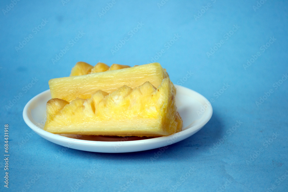 pieces of pineapple on a bright blue background can used for marketing creative pieces of pineapple on a bright blue background can used for marketing creative