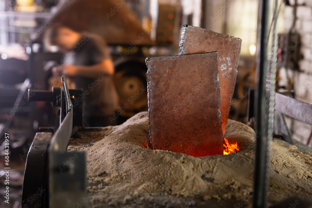 Foundry - ferrous metal is melted in an induction furnace of metallurgical plant Foundry - ferrous metal is melted in an induction furnace of metallurgical plant