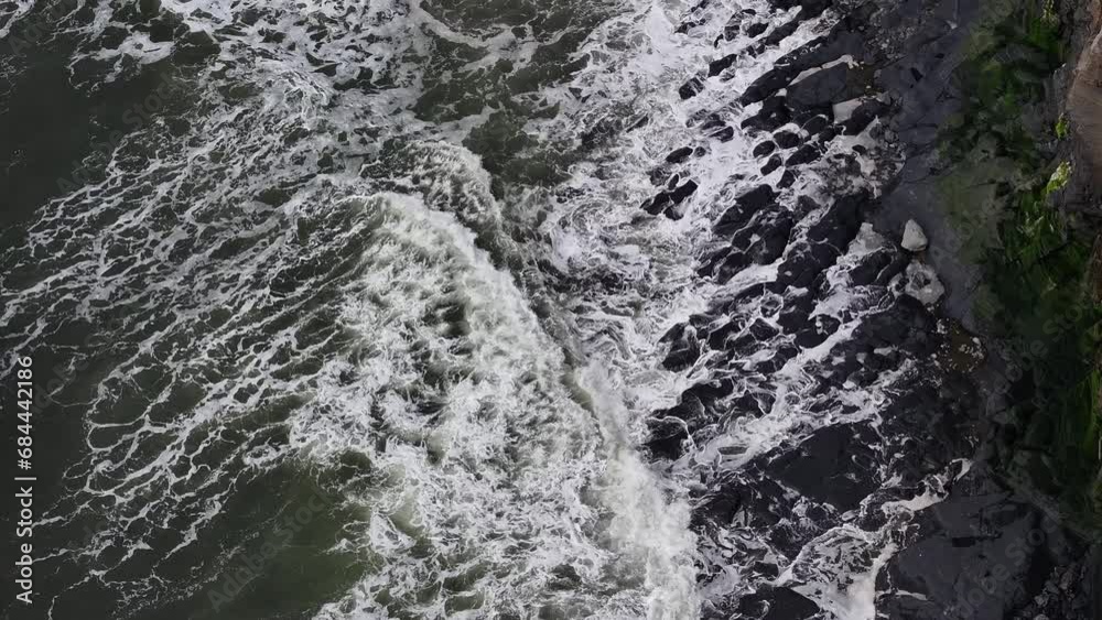 Top Down Aerial of Waves Hitting Rocks Top Down Aerial of Waves Hitting Rocks