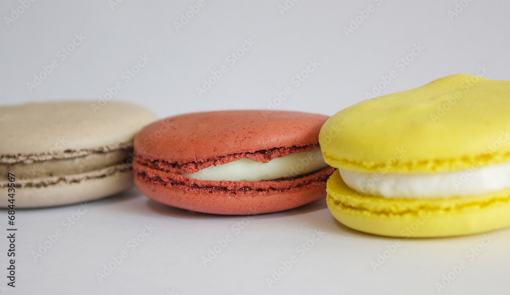 Sweet colorful macarons isolated on white background. 