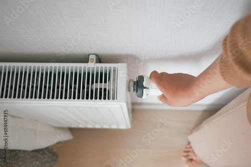 hand controls thermostatic knob of heating radiator photo