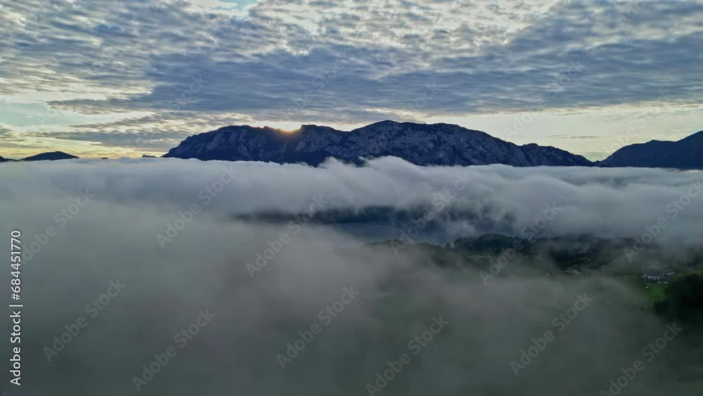 Low clouds over Attersee Lake, Austria in the morning - aerial Low clouds over Attersee Lake, Austria in the morning - aerial