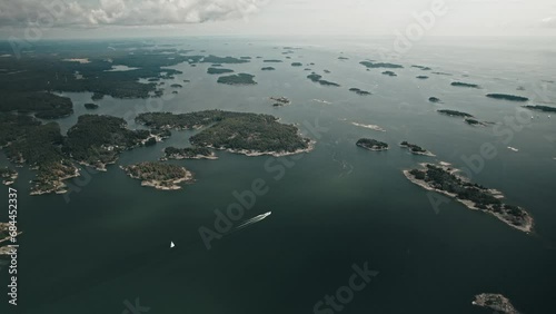 Aerial, Drone, Finnish coast with lots of islands and a boat driving through photo