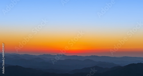 A landscape where the sun sets over the mountains. sunset © two K