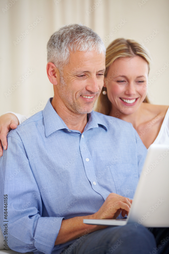Mature couple, laptop and video call with laugh, conversation and living room couch. Social media, technology and communication with family, man and woman with connection, streaming and happy Mature couple, laptop and video call with laugh, conversation and living room couch. Social media, technology and communication with family, man and woman with connection, streaming and happy