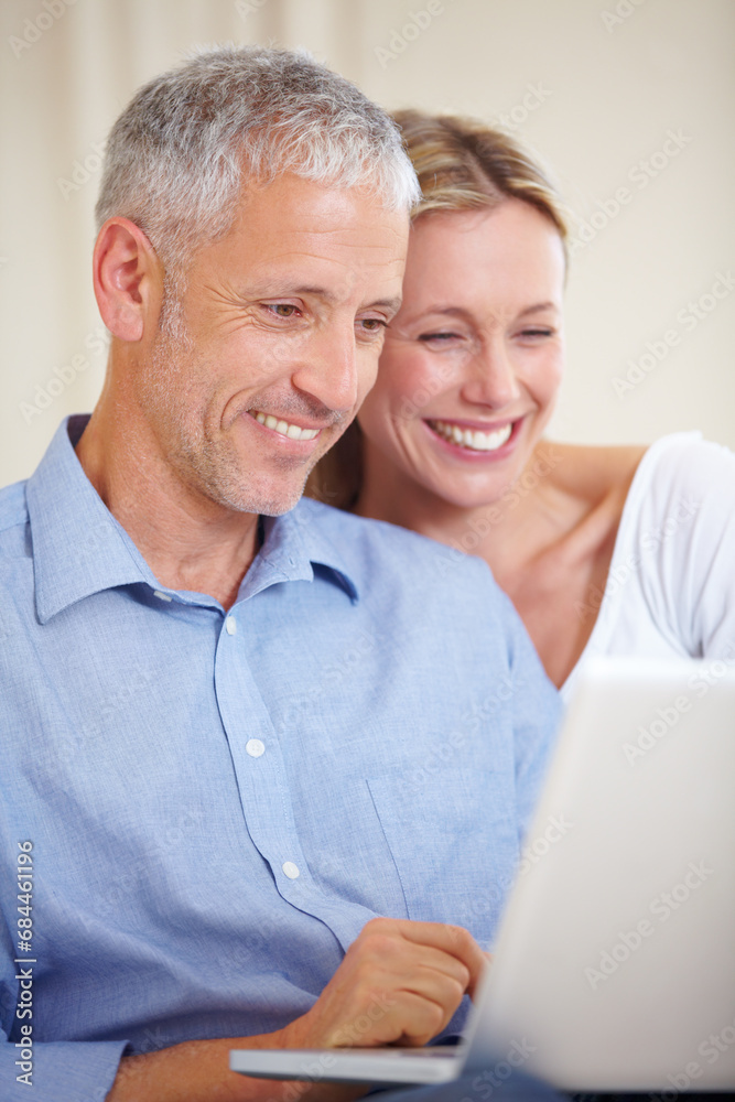 Mature couple, laptop and smiling with video call, conversation and living room couch. Social media, technology and communication with family, man and woman with connection, streaming and happy