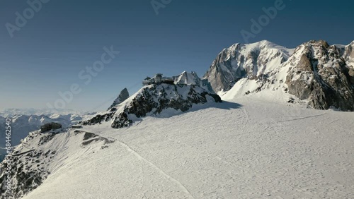 High alpine cablecar top station in front of mont blanc in winter aerial