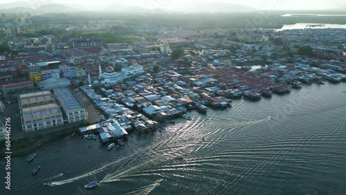 Aerial view of the city of Semporna at sunset in Sabah, Malaysia. Semporna is famous as an island where the Bajo ethnic community lives. photo