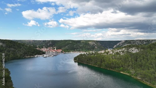 Aerial picturesque video with a small village at the Adriatic coast near town of Shibenik in Croatia. photo