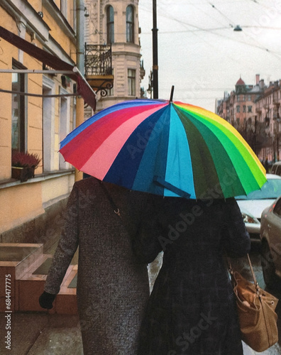 Woman gay couple under rainbow colored umbrella. Russia against diversity