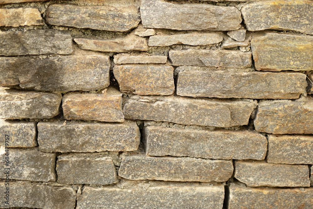Fototapeta premium Close up image of stone wall; grey stones