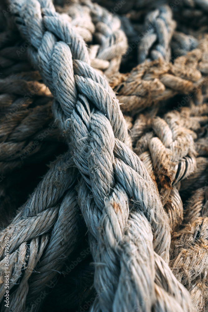 Old worn frayed ship ropes as background