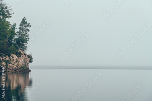 Lake Bohinj tranquil water surface in cloudy summer morning © Bits and Splits