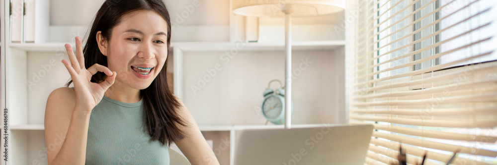 Young woman Working from Home, Video Call with Customer in Office, Remote Business Communication, Telecommuting Professional, Virtual Video Call with Office Customer, Work from Home Concept. Young woman Working from Home, Video Call with Customer in Office, Remote Business Communication, Telecommuting Professional, Virtual Video Call with Office Customer, Work from Home Concept.