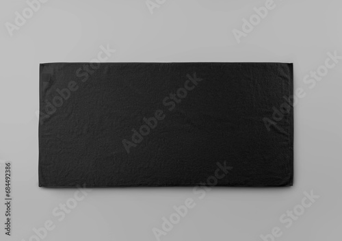 Template of trendy black towel with label isolated on background.