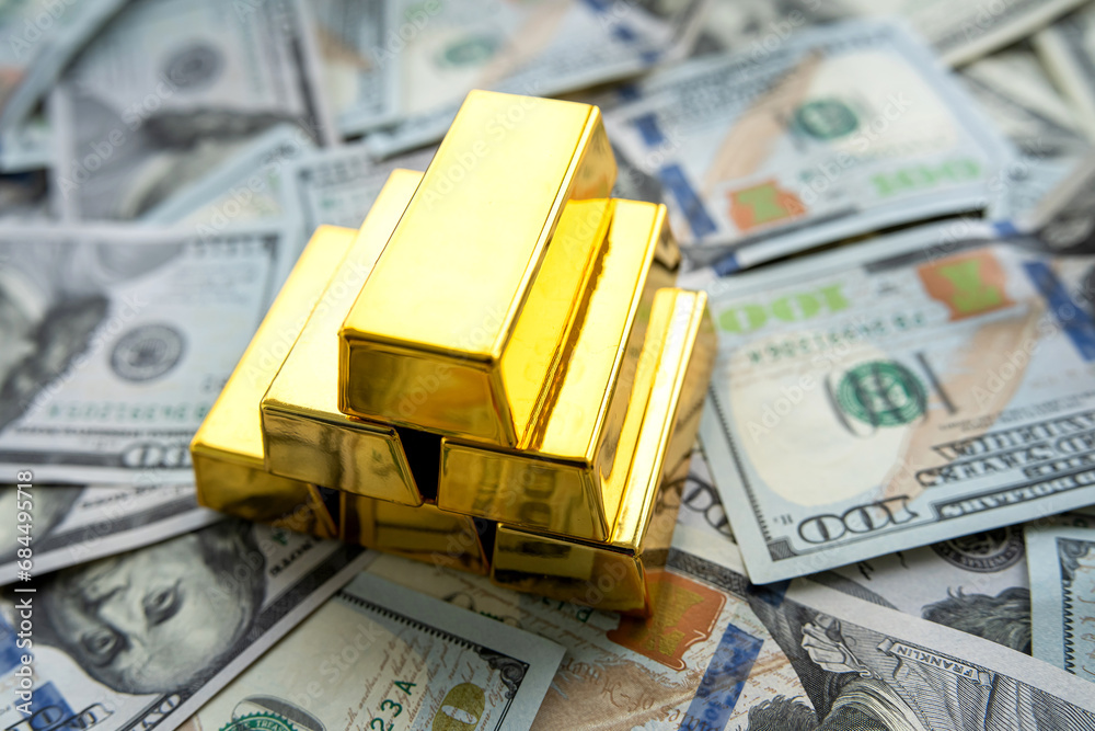 american dollar banknote and gold bullions, wealth and saving concept