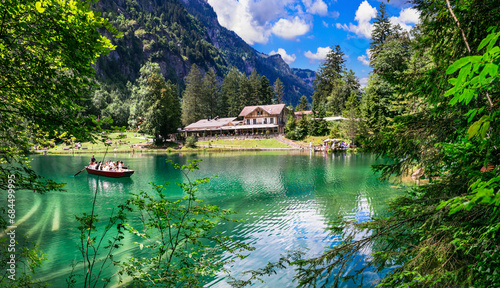 amazing Swiss mountain lakes - beautiful fairytale Blausee lake with clear trasparent waters. near Kandersteg village. Switzerland  travel and scenery photo