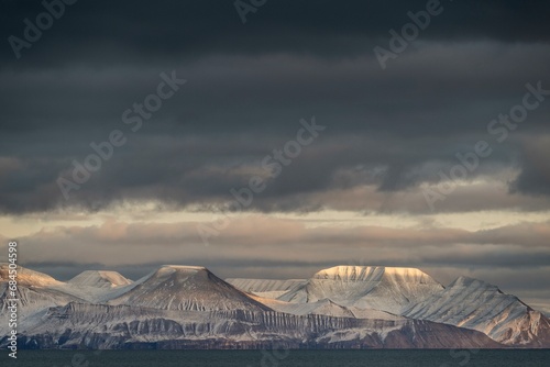 Evening atmosphere, snowy mountains, Nordfjorden, Isfjord, Spitsbergen, Svalbard, Norway, Europe photo