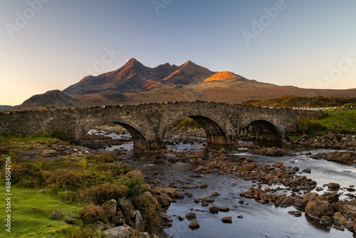 River Sligachan with old stone bridge, Cuillin Mountains in the background, Isle of Skye, Highlands, Inner Hebrides, Scotland, United Kingdom, Europe