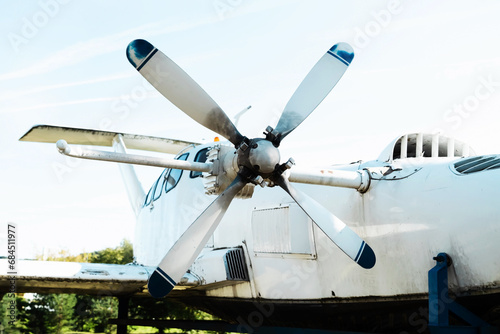 The propeller of an old small passenger plane. The aircraft with four blades is prepared for recycling and disposal. Close-up