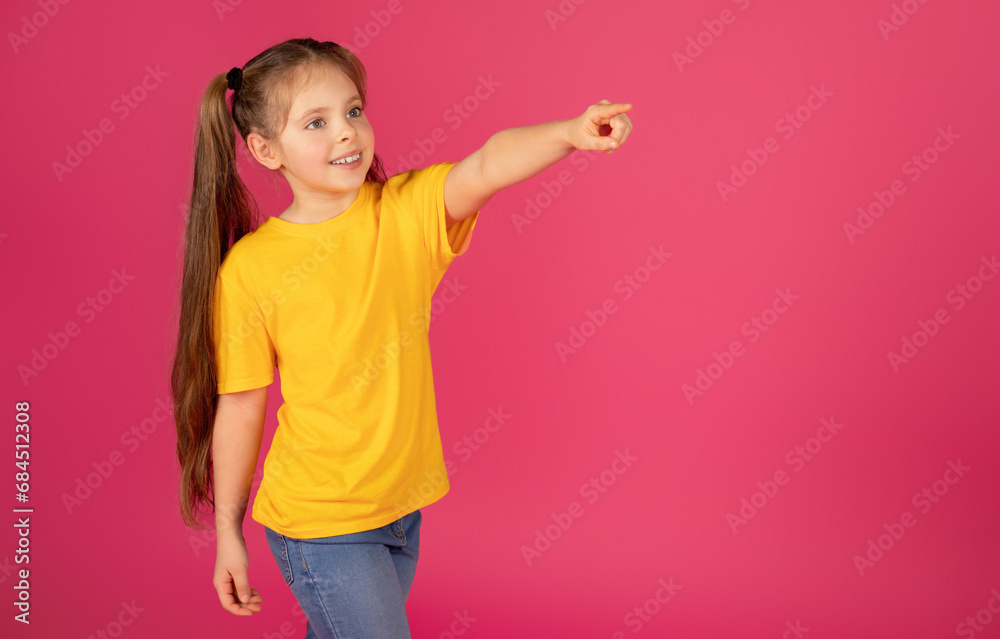Check This. Cute Little Girl Pointing Aside At Copy Space With Finger Check This. Cute Little Girl Pointing Aside At Copy Space With Finger
